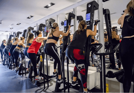 Group using exercise machines with BYE BYE, TOXIC AND SMELLY LUBRICANTS FOR EXERCISE EQUIPMENT – HELLO PLANETSAFE