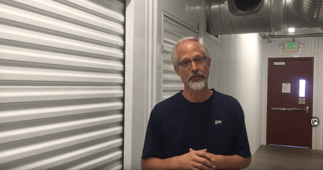 Expert discussing the best lubricant for storage units, locks, doors, and dollies in a storage facility.