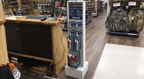 Display Stand Now Available For Retailers featuring PlanetSafe lubricants in a store setting