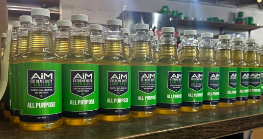 Freshly bottled AiM Extreme Duty All Purpose 16 oz lubricant bottles on the shelf at the PlanetSafe Lubricants shop in St. George, Utah