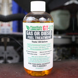 GT-DT Gas or Diesel Fuel Treatment (Additive, 8oz) bottle on automotive engine background, eco-friendly fuel system cleaner and rust prevention